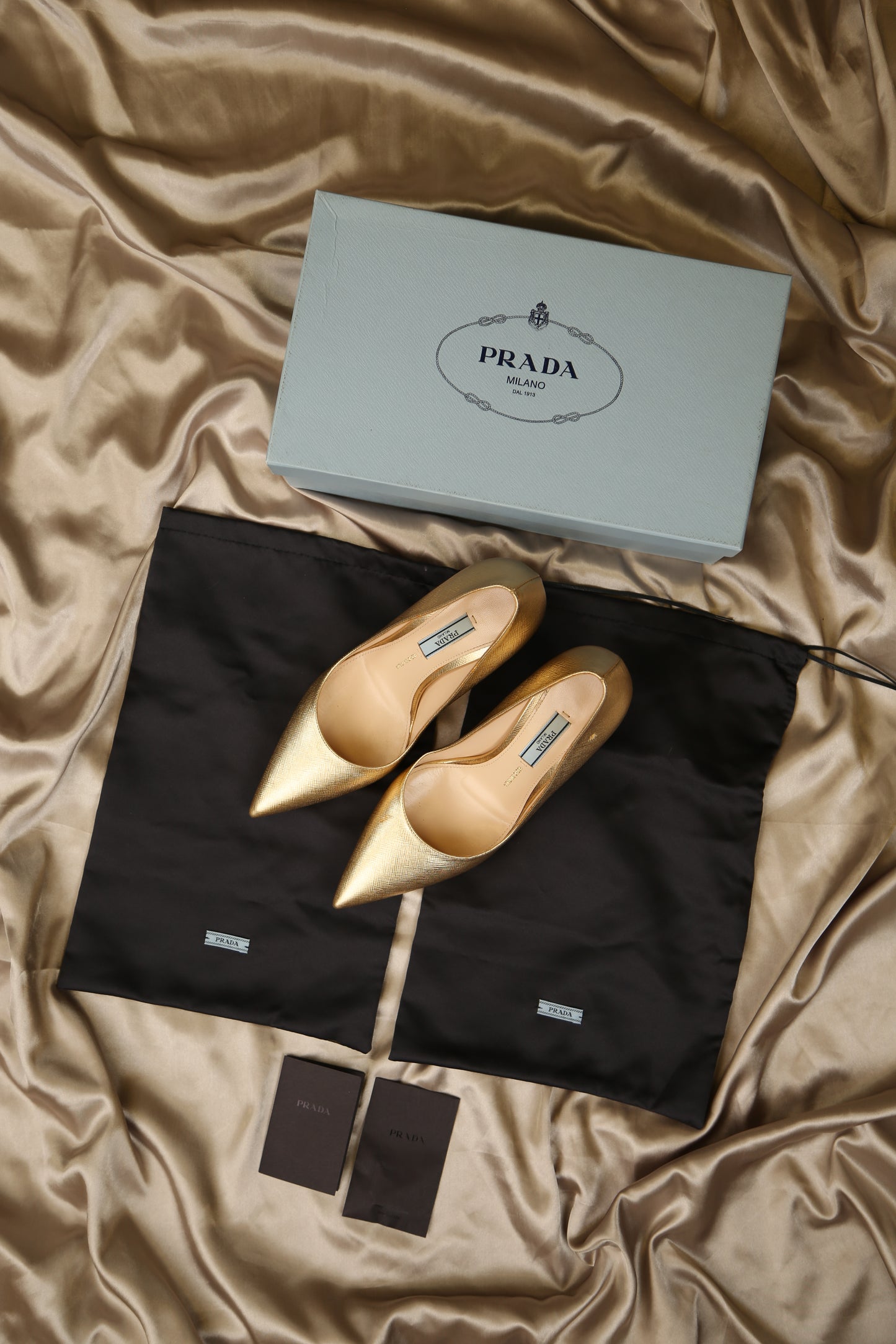 PRADA Gold Saffiano Pumps